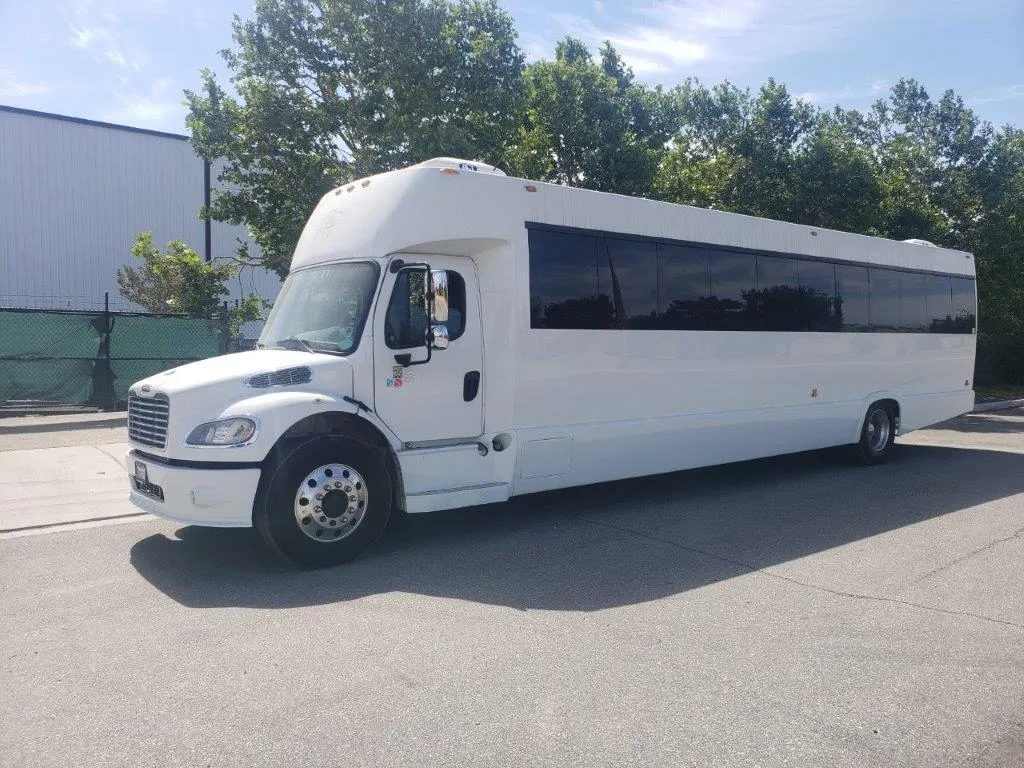 White limousine bus with tinted passenger windows